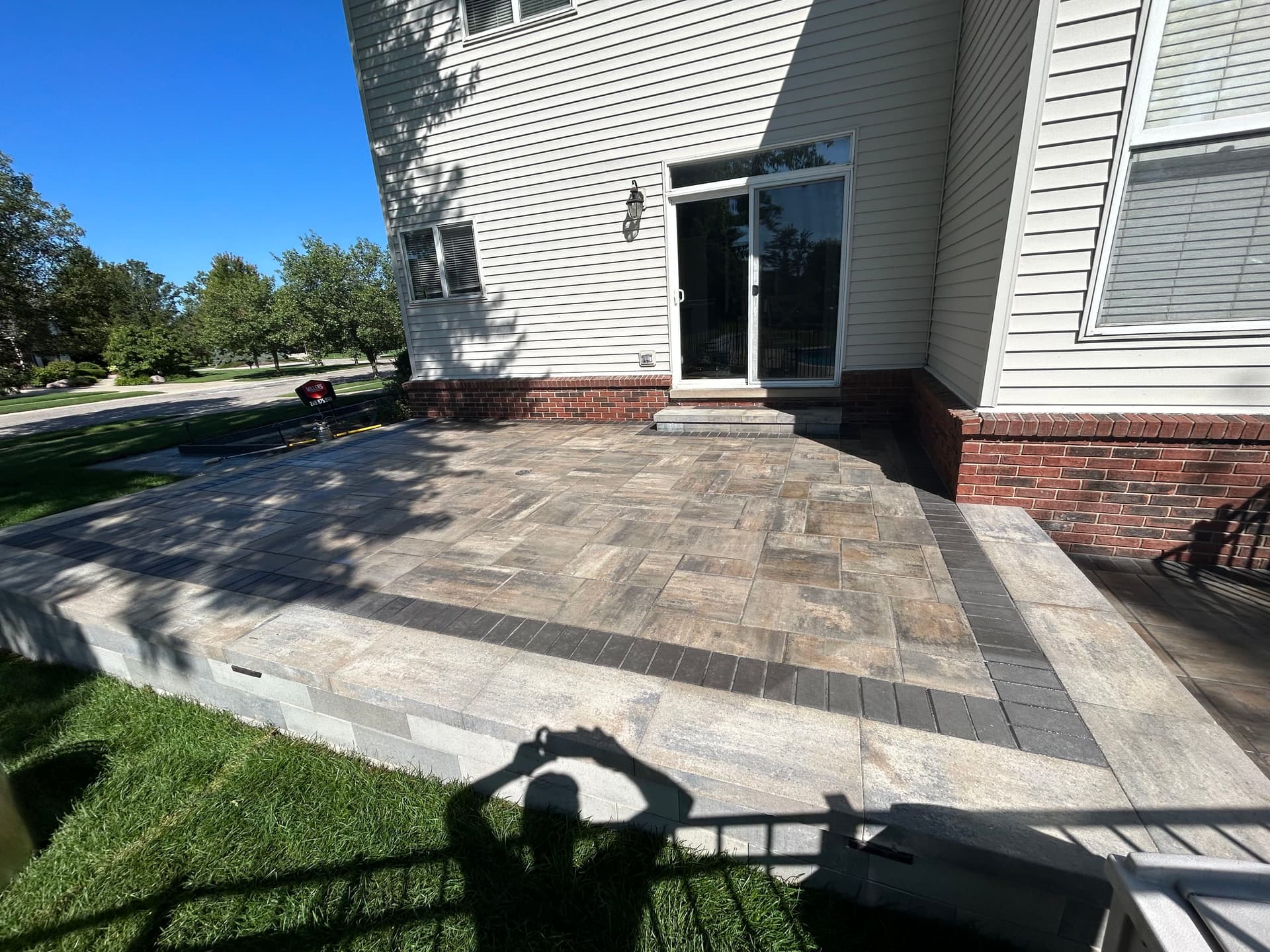 Paver Patio With Retaining Walls and Outdoor Lighting in South Lyon image