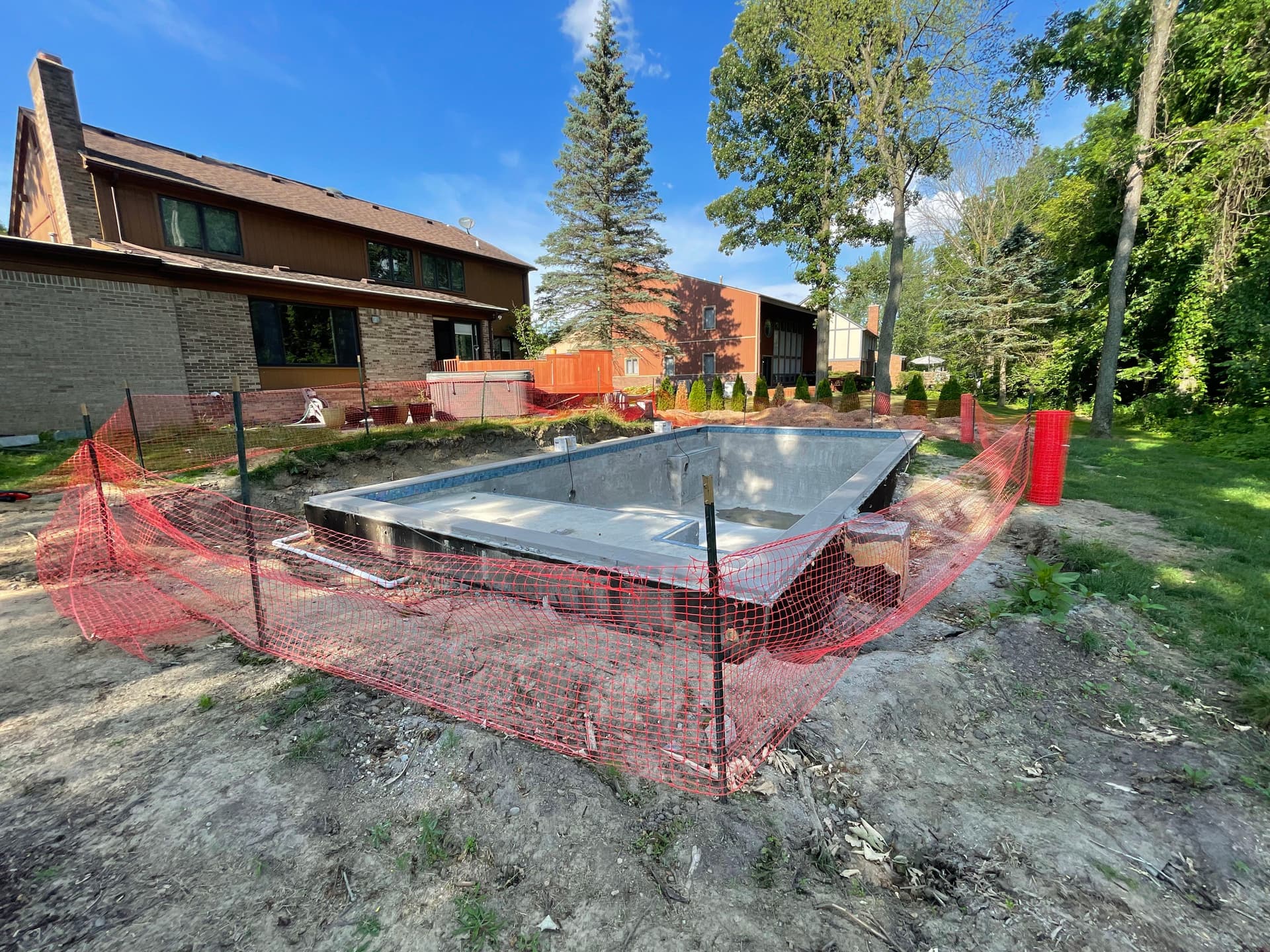 Gunite Pool Installation with Pavers and Lighting in Farmington Hills image