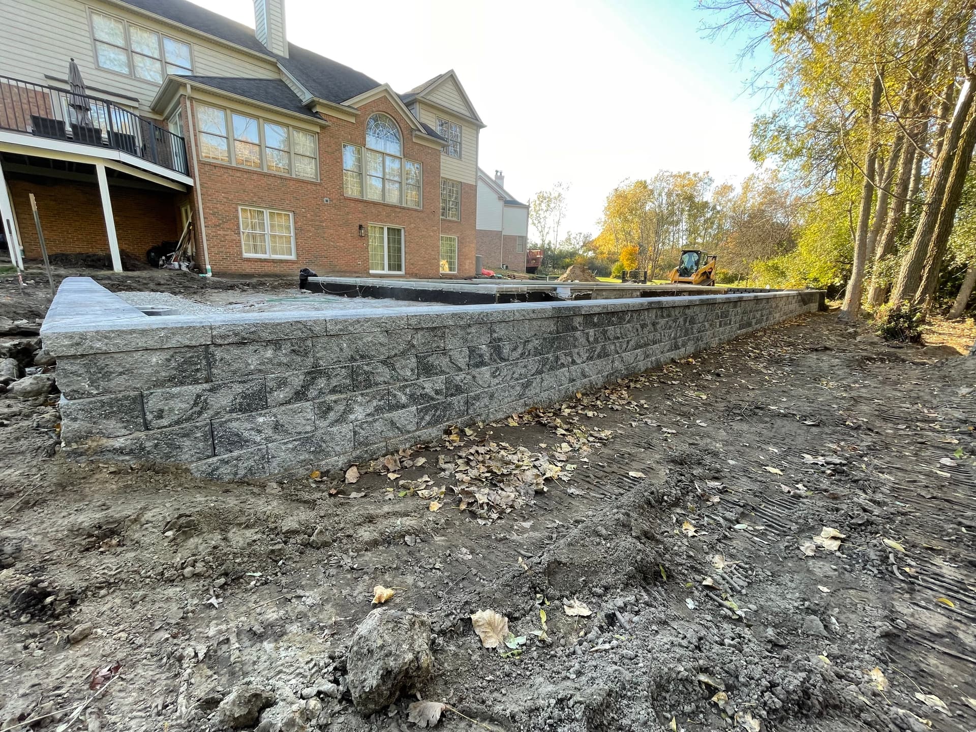 Poolside Retaining Wall Built Right From the Ground Up image