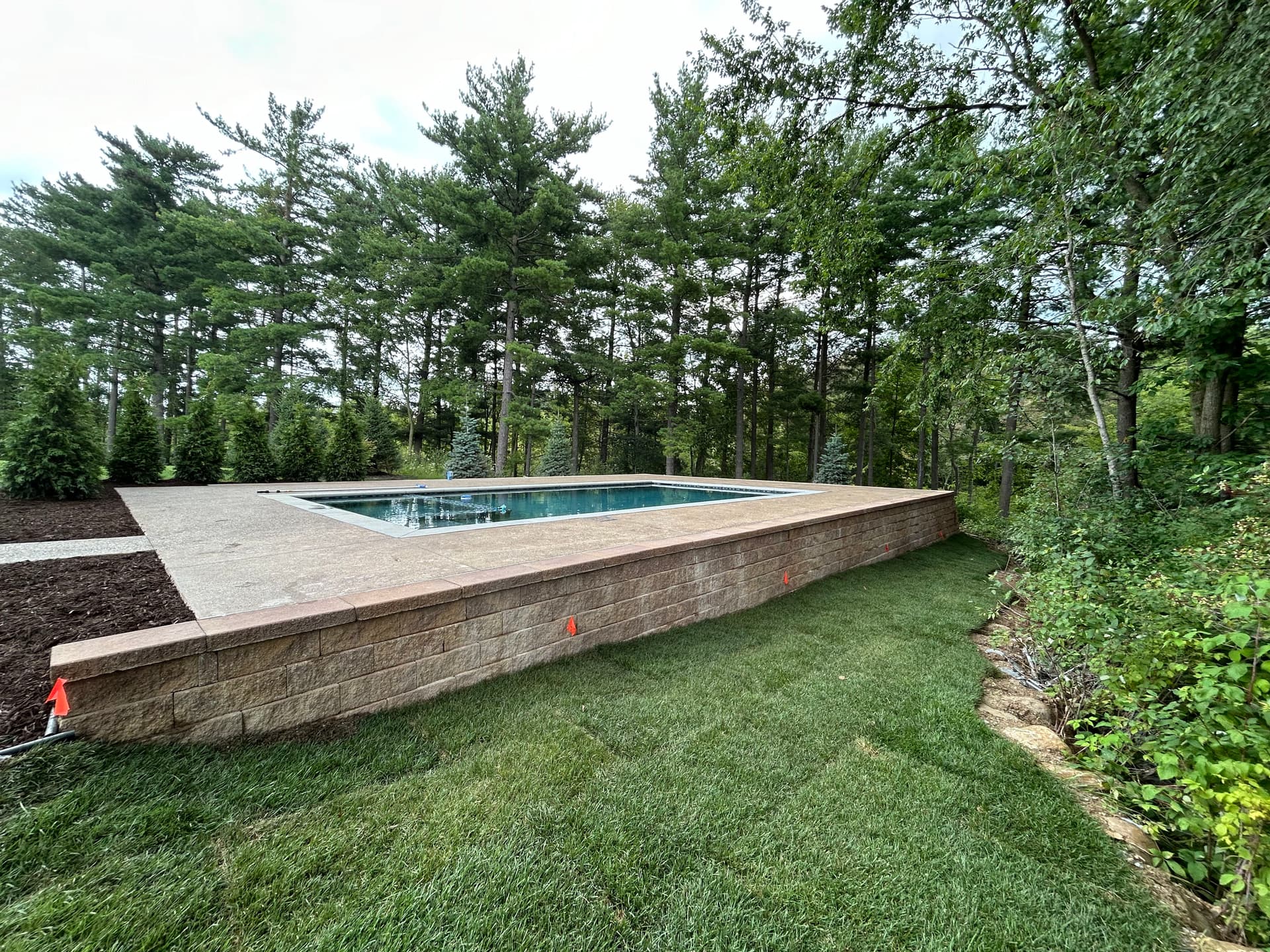 Pool Install with Retaining Wall and Landscaping in South Lyon image