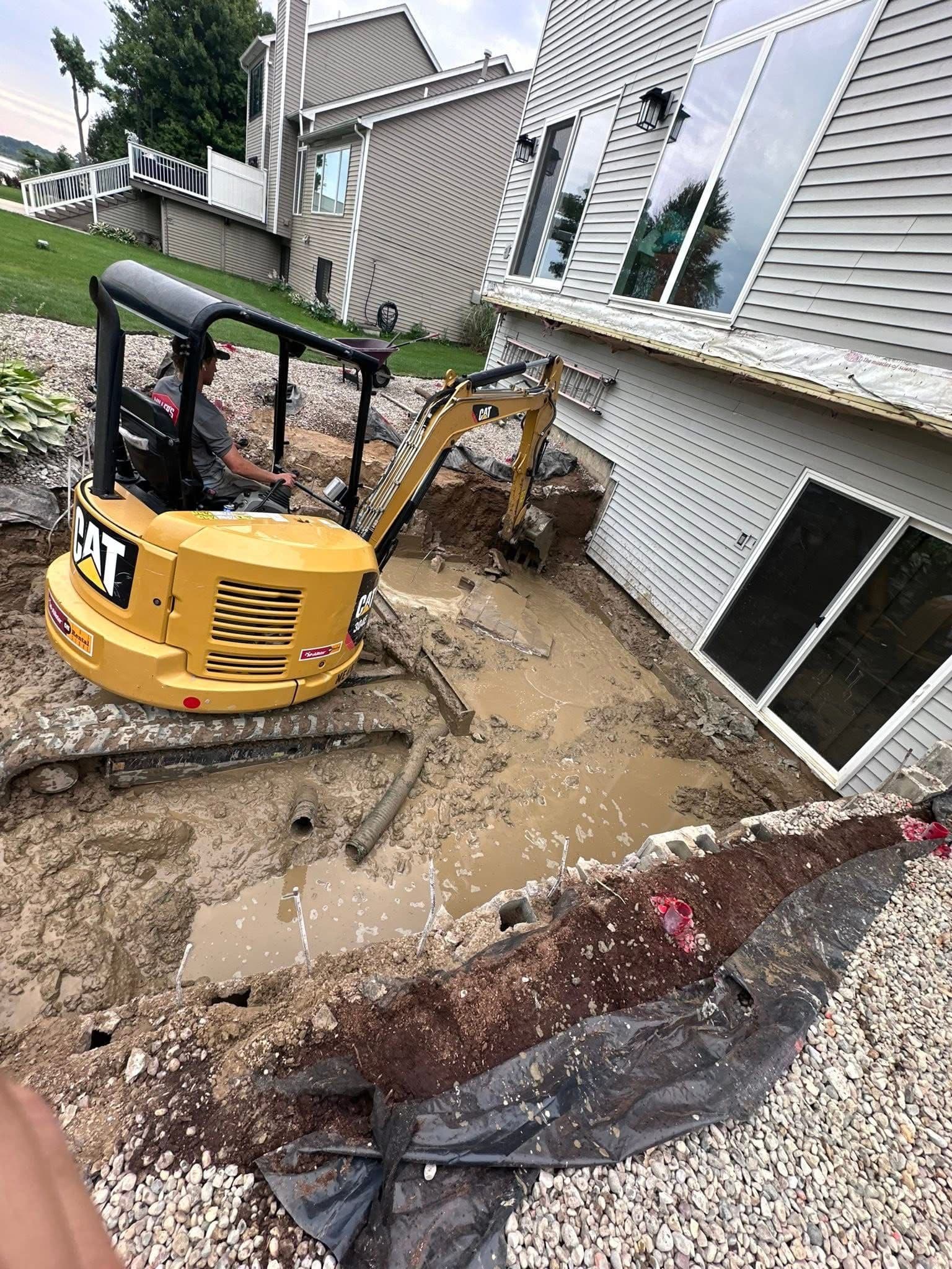 Paver Patio and Retaining Wall Build in Linden That Started Way Underground image